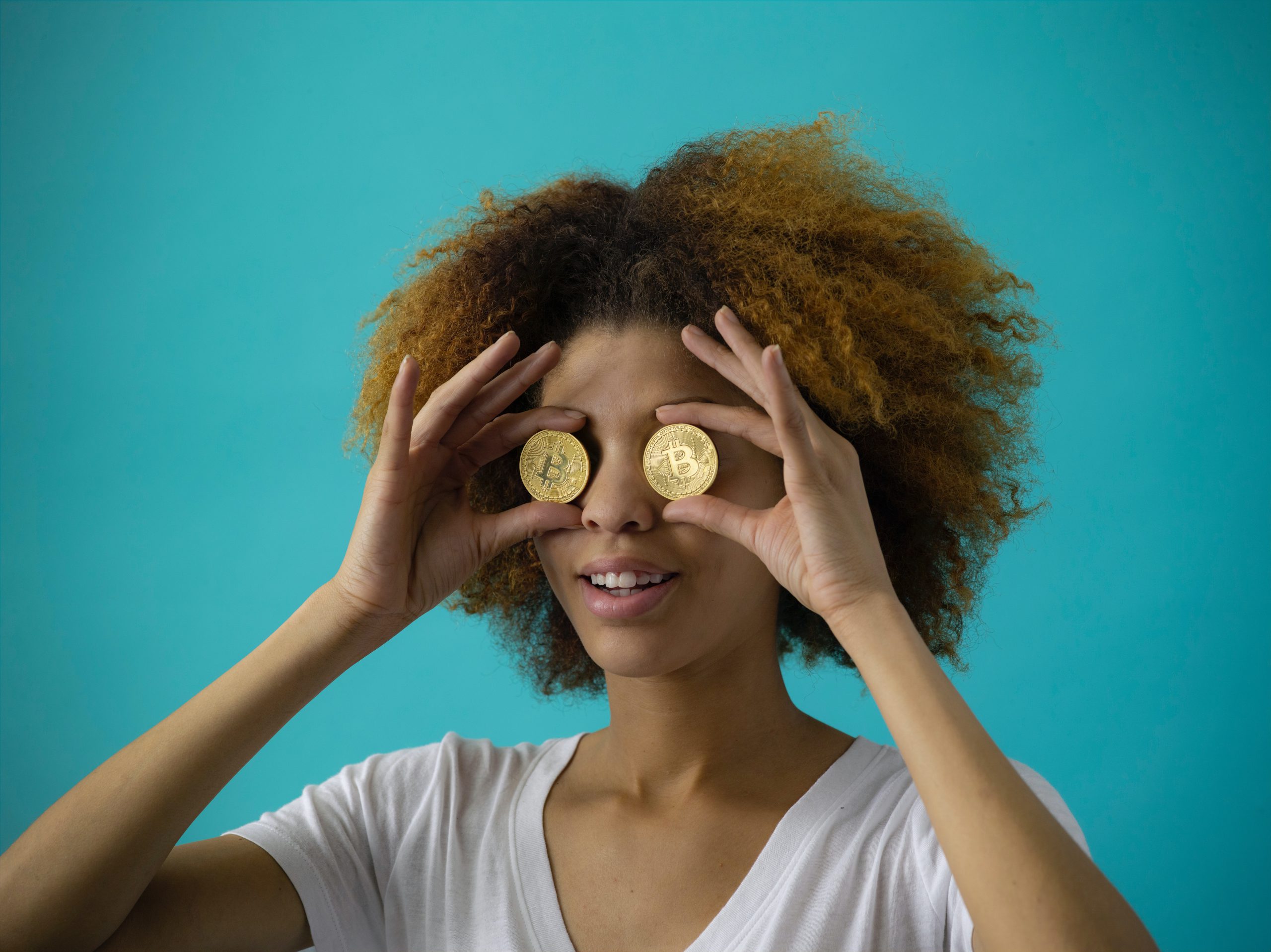women-holding-bitcoin-eyes